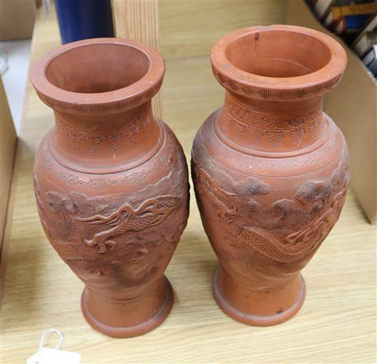 A pair of Japanese pottery dragon vases, height 30cm